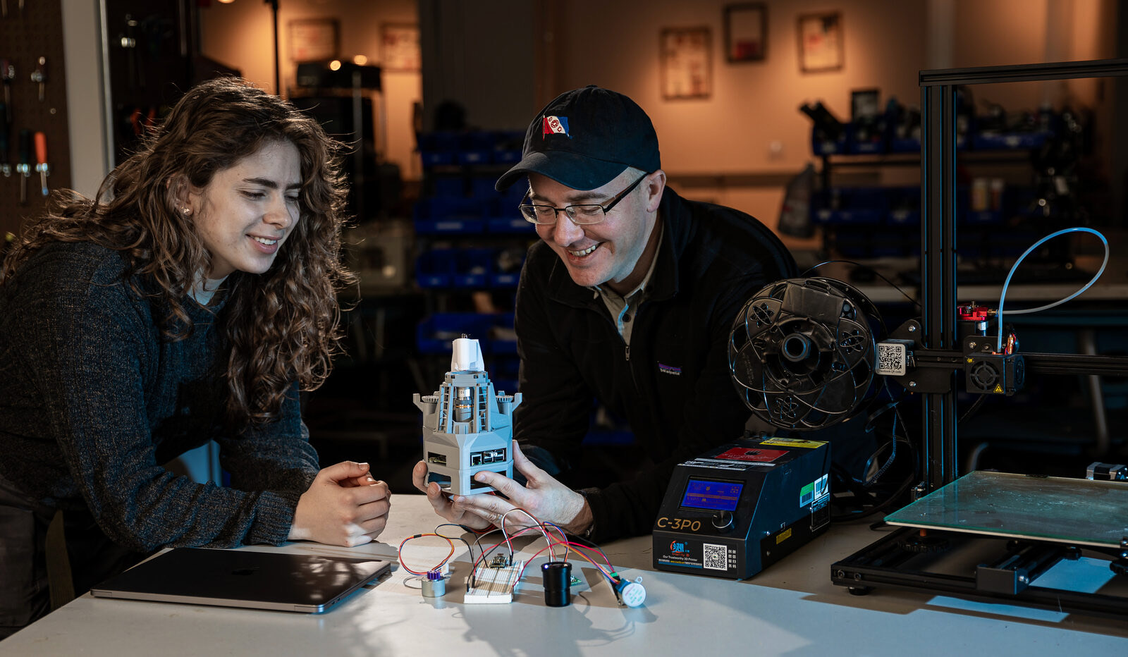 A student and instructor testing a 3D-printed prototype